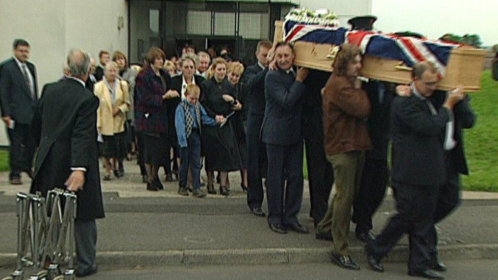 David Johnston's family walk behind his coffin on the day of his funeral