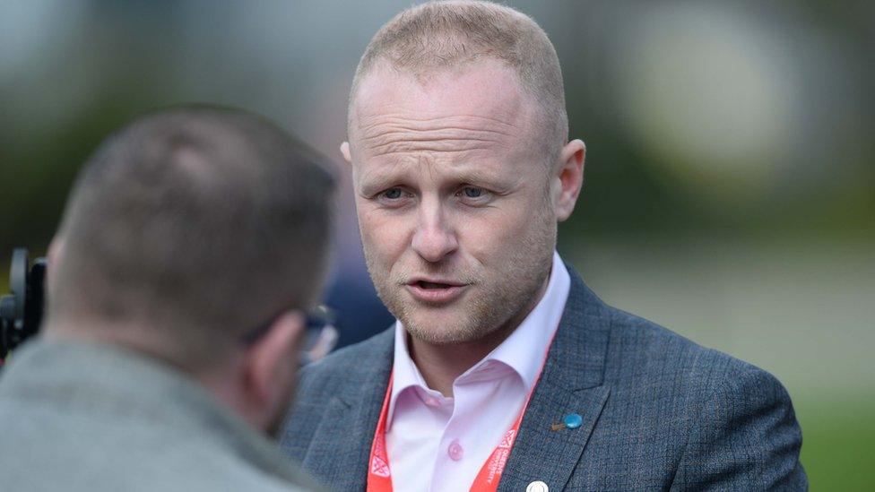 Jamie Bryson at Queens University Belfast peace deal event