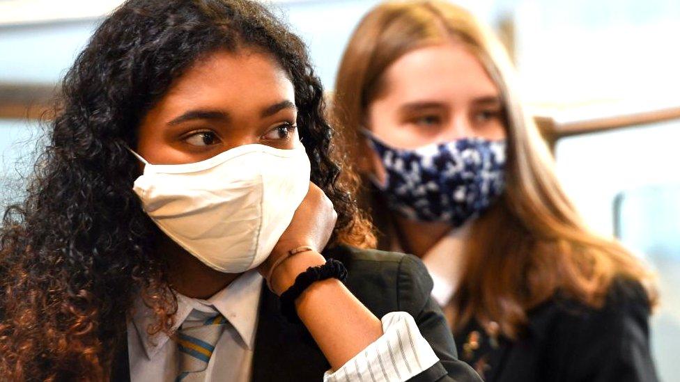 Two young people in masks