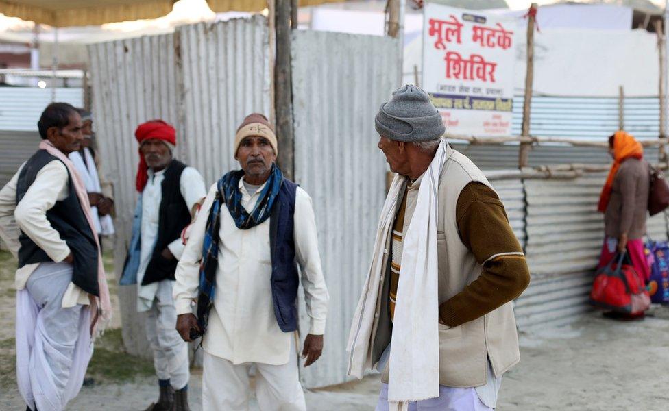 Men outside Bhule Bhatke Shivir in Allahabad