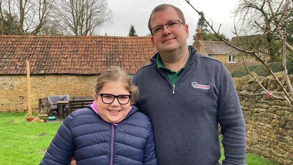 Emily and her father Chris in the family garden