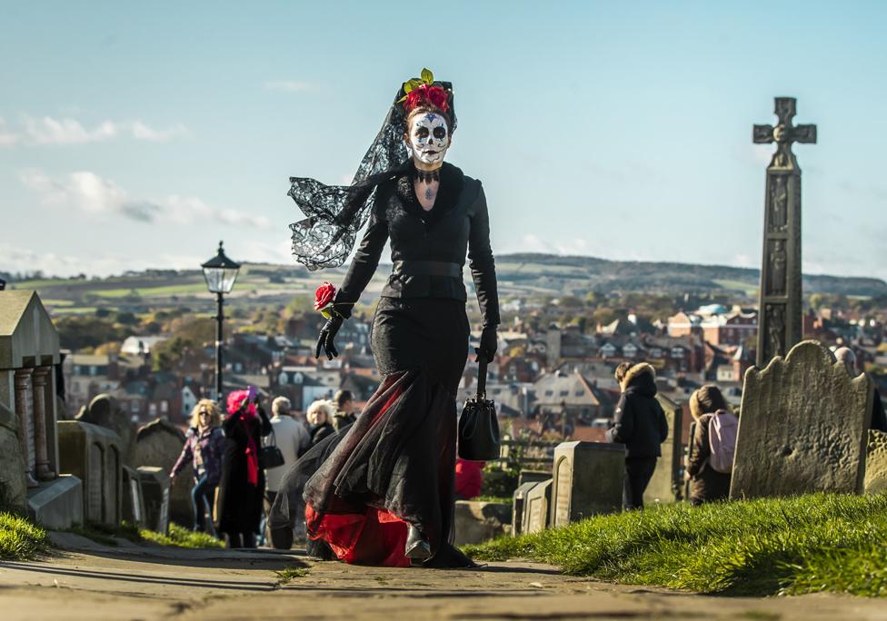 A costumed woman in a graveyard at the Whitby Goth Weekend