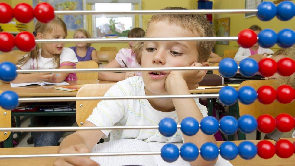 Child with abacus