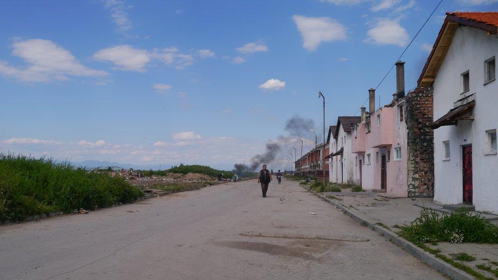 Street in Pazardjik with houses in precarious conditions and abandoned land