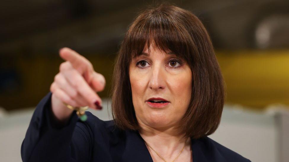 Rachel Reeves answering questions following a speech in Oxfordshire in January. The Chancellor is pointing to someone in the audience.