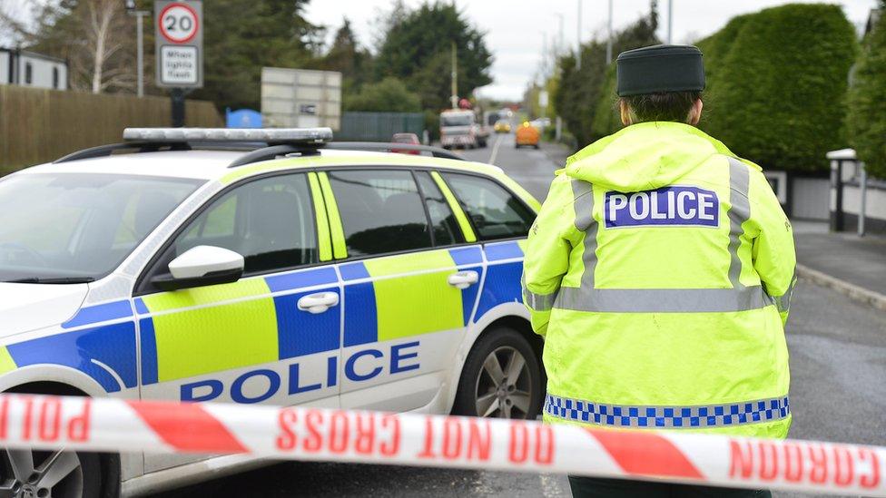 A police officer and a police car at a cordon on Moy Road in Portadown