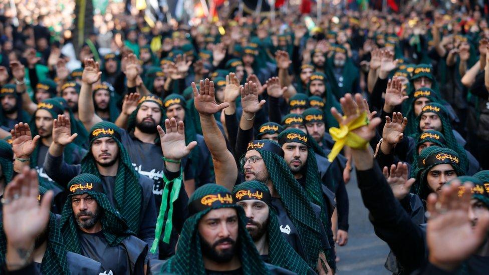 Supporters of Hezbollah take part in a parade to mark Ashura in Beirut on 20 September 2018