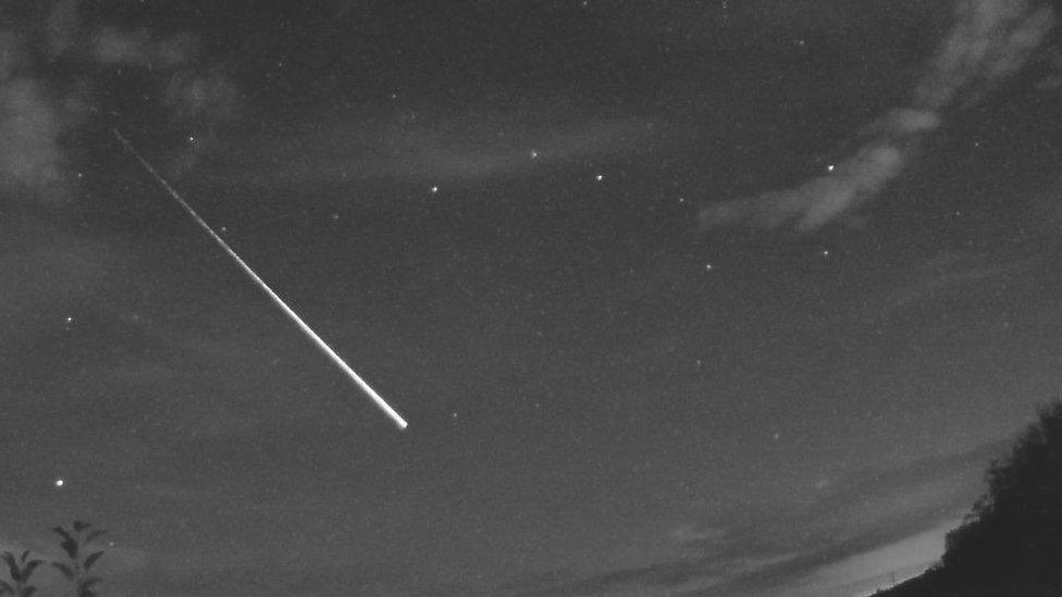 Fireball, that looks like a shooting star, over the sky