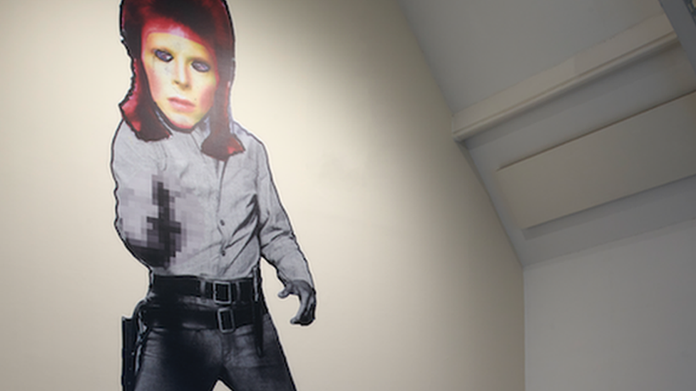 Giant image of David Bowie on a gallery wall