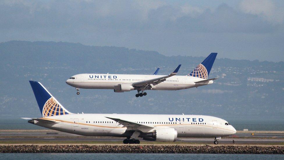 A United Airlines Boeing 787 taxis as a United Airlines Boeing 767 lands at San Francisco International Airport, San Francisco, California, 7 February 2015