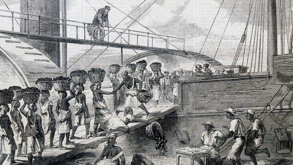 Enslaved people loading coal on to a ship