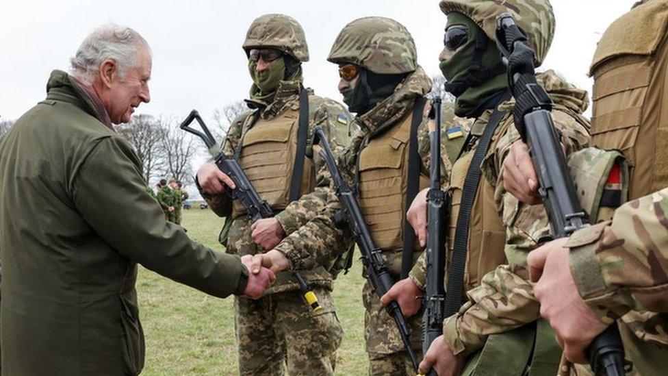 King Charles shaking hands with soldiers