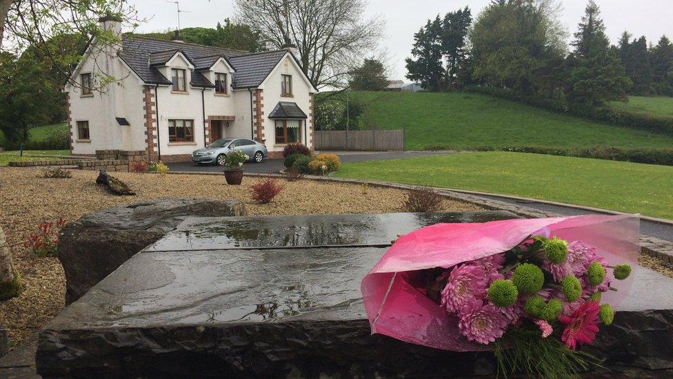 A bunch of flowers placed on a pillar outside the grounds of the house where Concepta Leonard lived