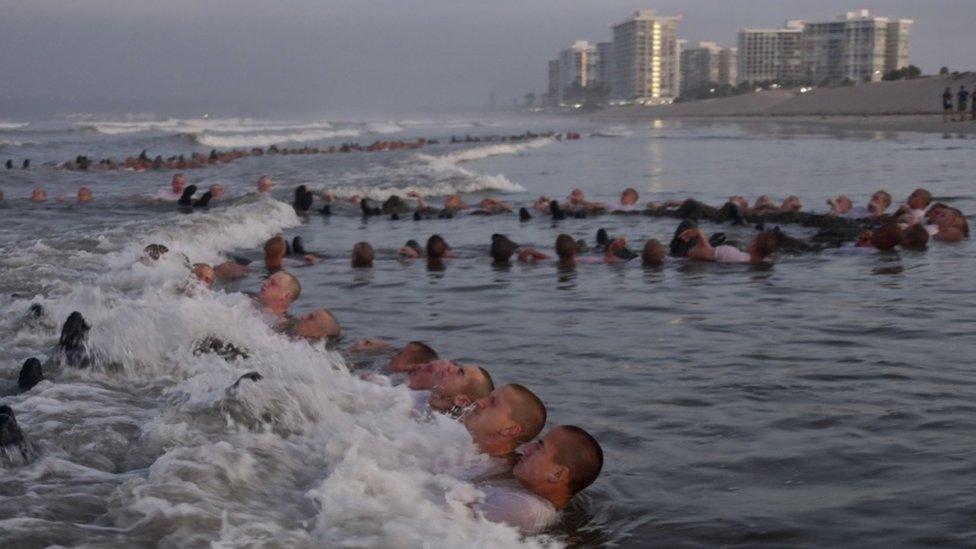 Sailors in the water during training