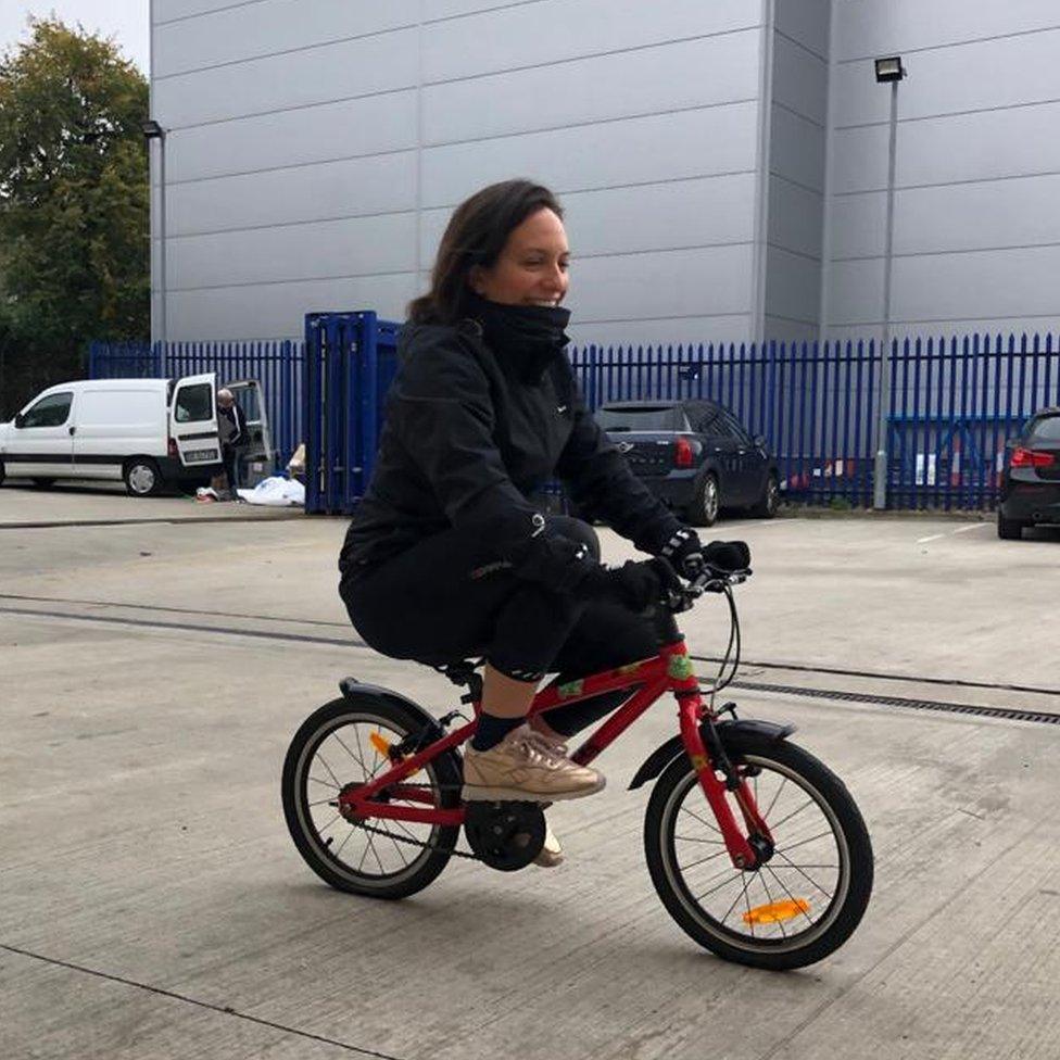 Laura cycling to work.