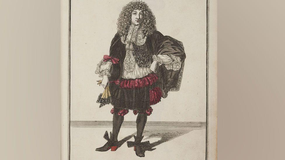 A fashion print drawing of a late 17th Century man wearing a curly long wig, black jacket and pantaloons, decorated with red ribbons over a white lace trimmed shirt, plus black stockings and black shoes with red high heels