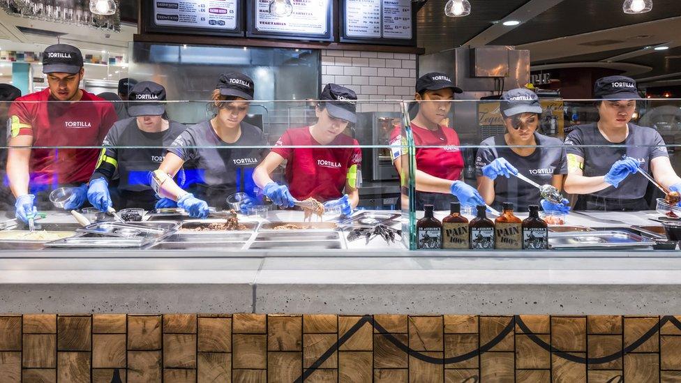 People working at a tortilla shop