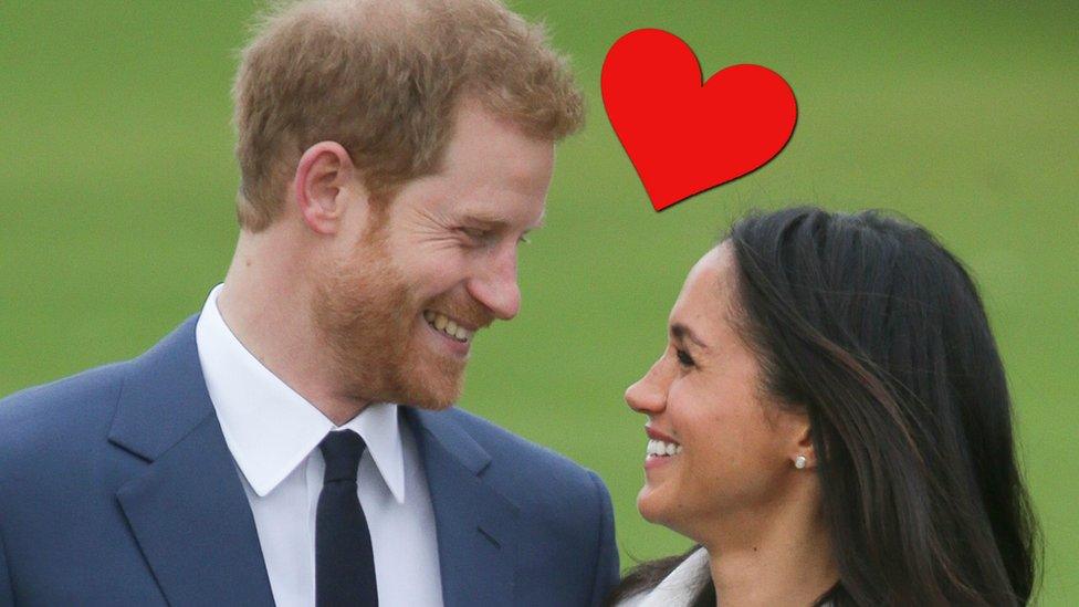 Prince Harry and Meghan Markle smile at one another with a big red heart above their heads