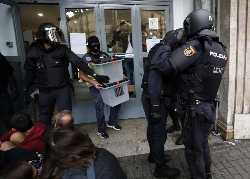 Police seize ballot boxes from a polling station