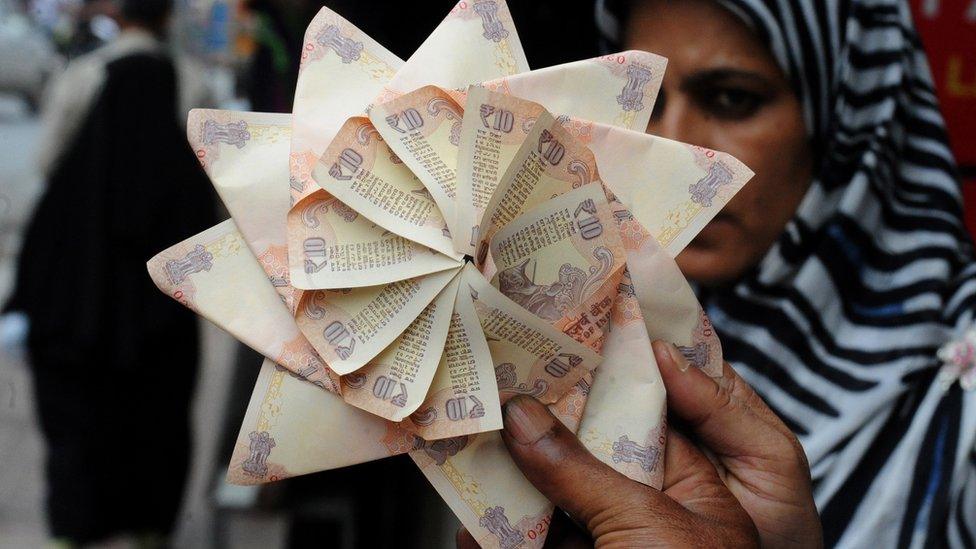 Rupee notes in a fan