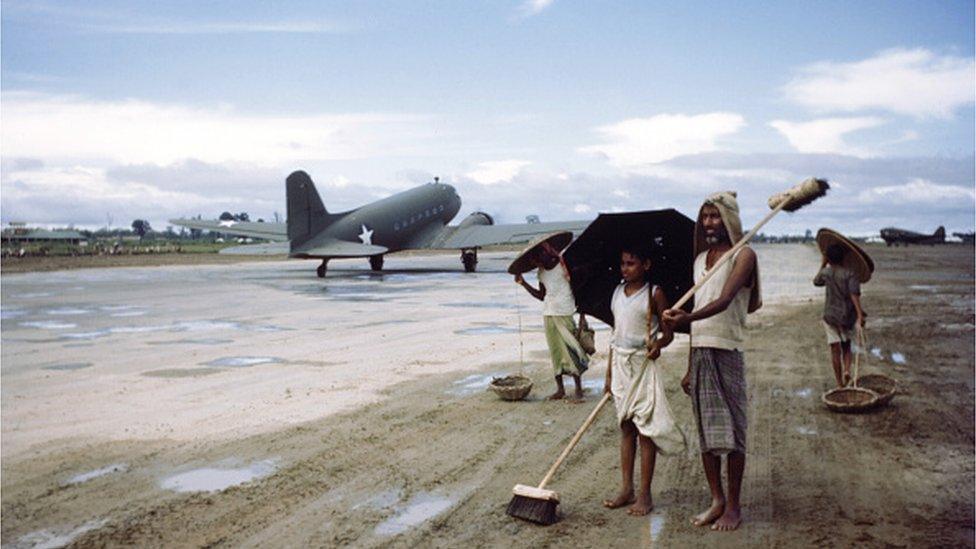 A view local Indians sweeping the military runway in fields in Sadiya, Assam India. Circa 1943. (Photo by Ivan Dmitri/Michael Ochs Archives/Getty Images)