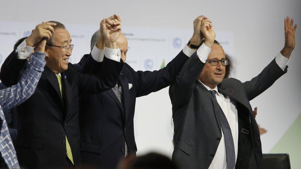 World leaders holding hands in jubilation