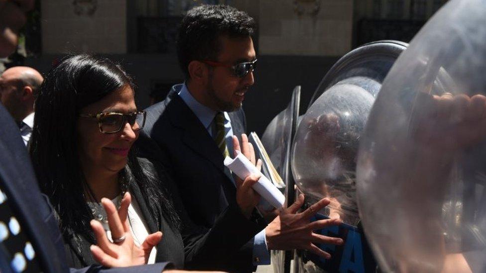 Venezuela's Foreign Minister Delcy Rodriguez, is blocked by riot police officers before entering the Argentine Foreign Ministry in Buenos Aires during a meeting among Mercosur's ministers where Venezuela was not invited, on December 14, 2016