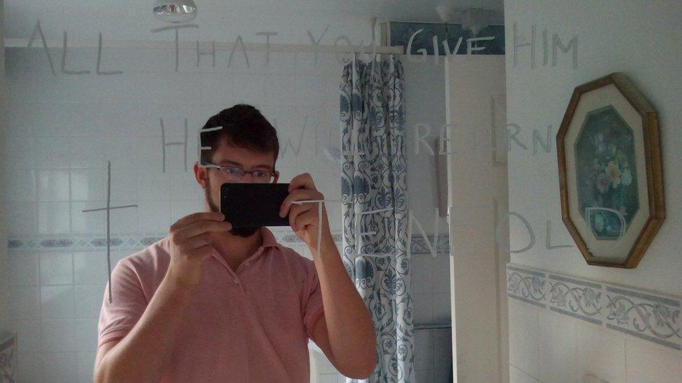 Ben Field in front of mirror message