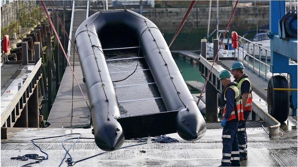 A small boat used for crossing the channel is removed from the water