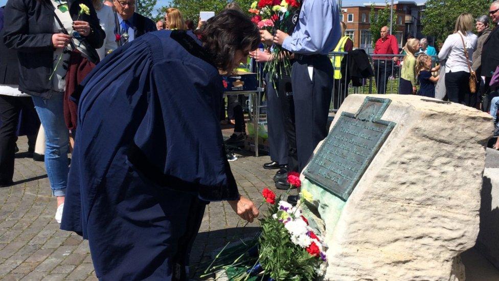 Laying flowers at the Falklands memorial