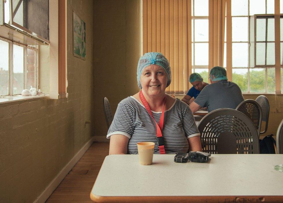 A caterer sitting in a canteen