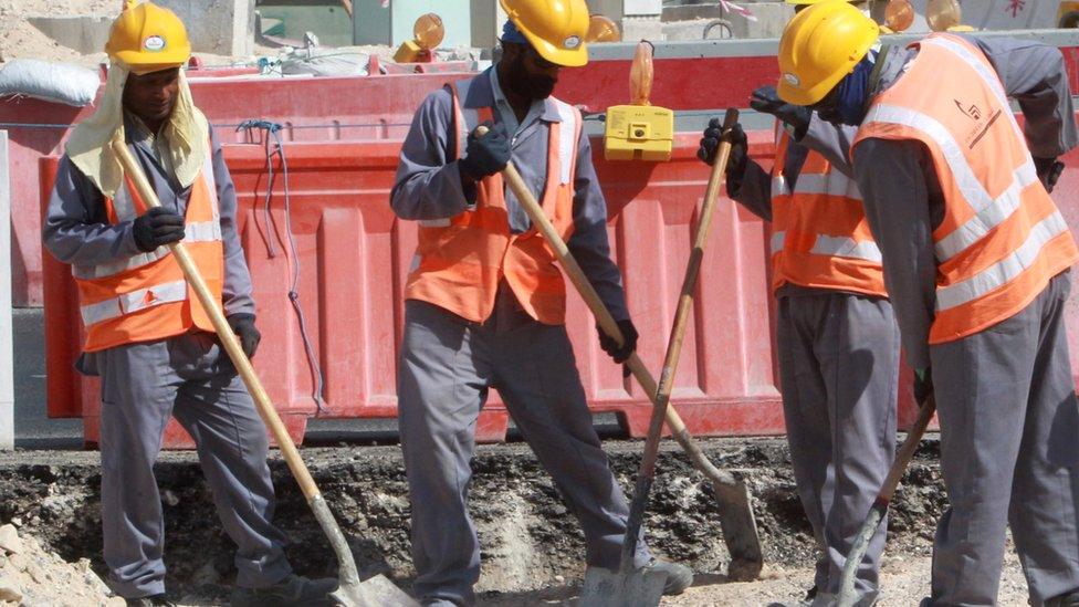 Workers at a construction site in Doha on 16 November 2014