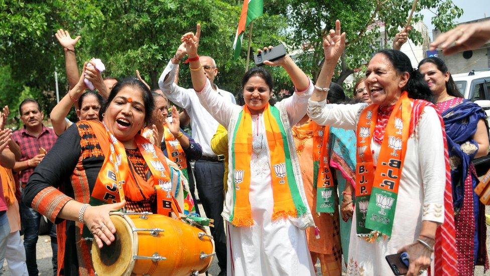 BJP supporters celebrate after Union Home Minister Amit Shah introduced the proposal to remove Article 370 in the state on August 5, 2019 in Jammu, India.