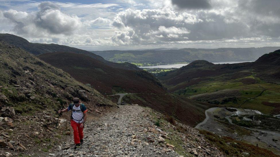 Walker on the route to Wetherlam