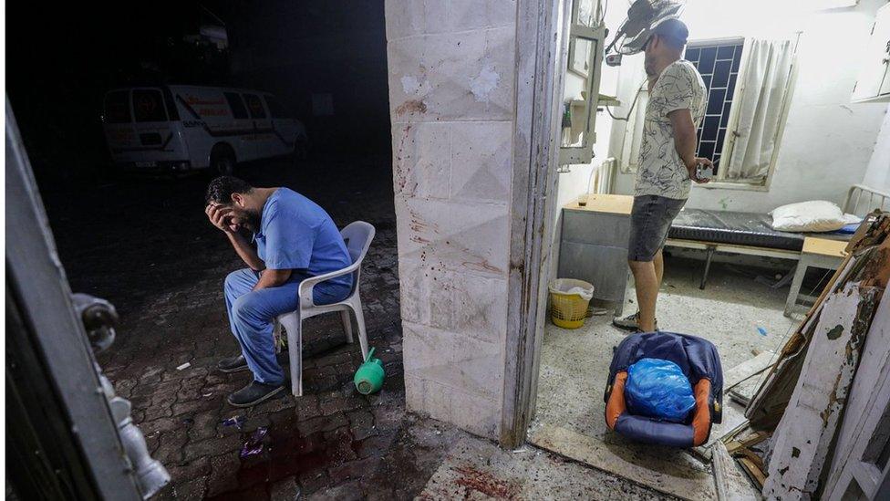 A doctor at the scene of Al Ahli hospital after an air strike in Gaza City