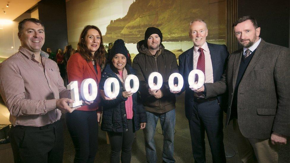 Tourists and officials celebrating the milestone