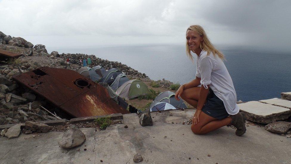 Conservationist Salina Janzan looks out over the make-shift camp