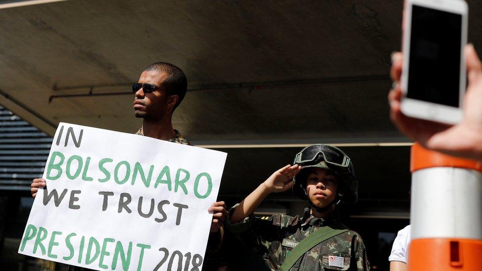 Supporters of Jair Bolsonaro stand in front of the Albert Einstein hospital after Bolsonaro was stabbed by a man in Juiz de Fora, in Sao Paulo, Brazil September 7, 2018