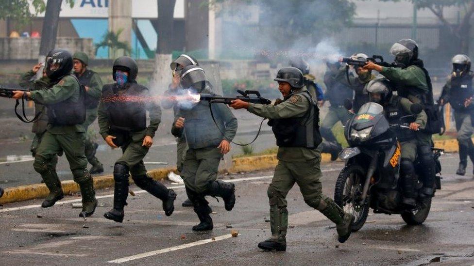 Riot security forces take up positions while clashing with demonstrators rallying against Venezuela's President Nicolas Mauro's government in Caracas, Venezuela, July 28, 2017.