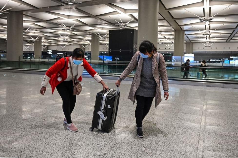 People in masks at international airport