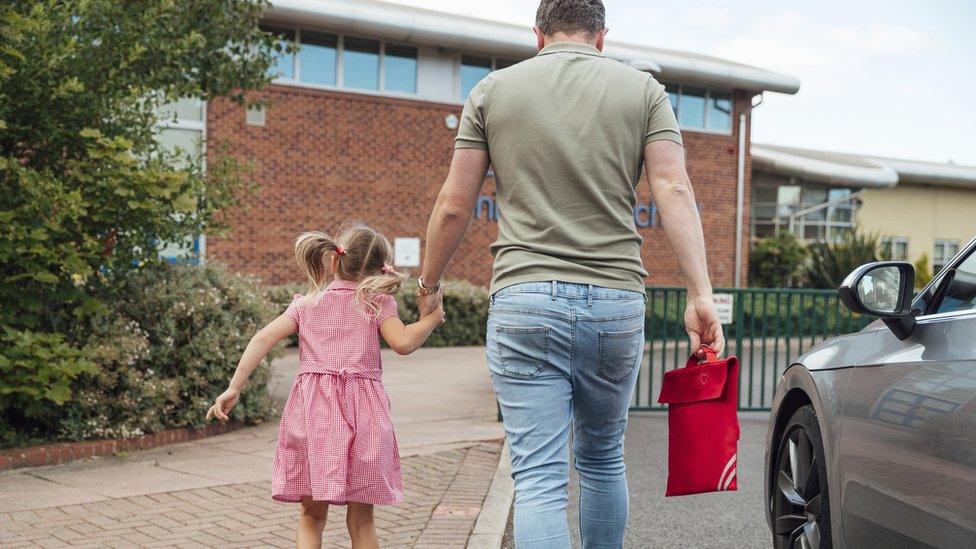 girl-walking-with-parent-to-school.