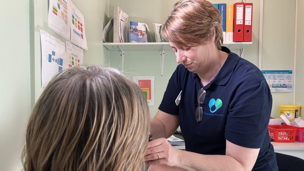 Dispensing Assistant Sarah Manuel from Blackbrook Pharmacy in Taunton carries out blood pressure checks.