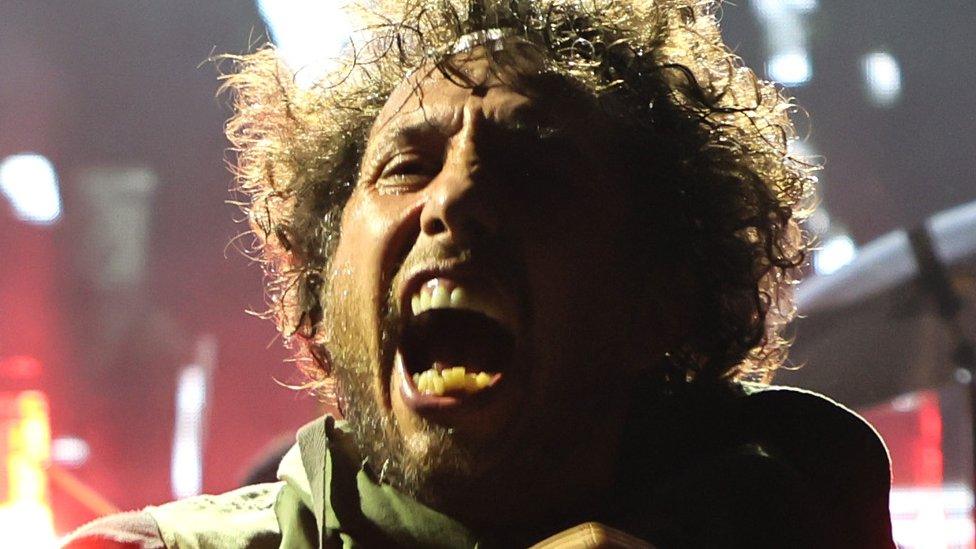 Zack de la Rocha performing seated at Madison Square Garden in New York on 8 August