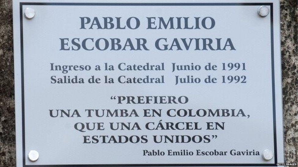 A plaque remembering late Colombian drug lord Pablo Escobar is seen at the Benedictine monks at the site of the Catedral prison