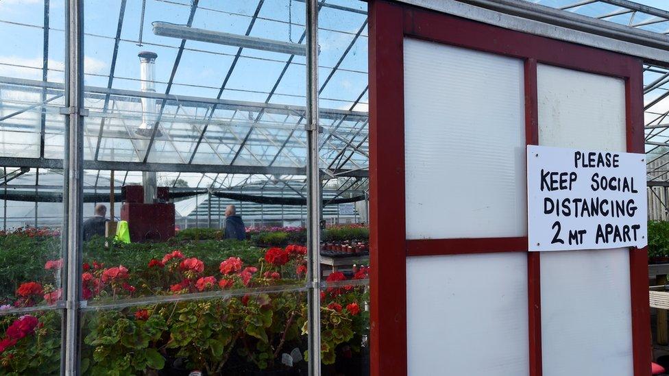 A social distance sign is seen at Cosheston Garden Centre in Pembroke Dock, following the outbreak of the coronavirus disease (COVID-19), Pembroke Dock, Wales