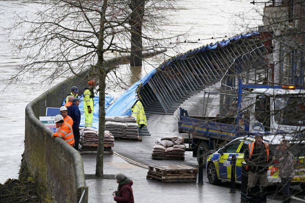 In Ironbridge, flood barriers are erected on the banks of the River Severn.