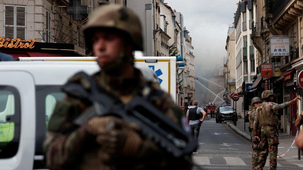 French soldiers and police secure the area