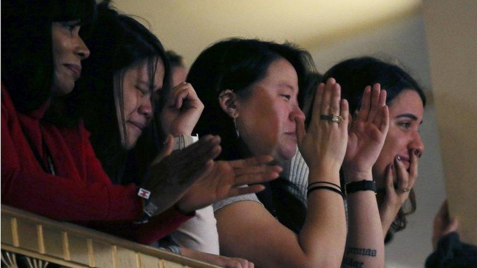 Hillary Clinton's campaign staff react as she addresses them at a hotel in New York, November 9, 2016