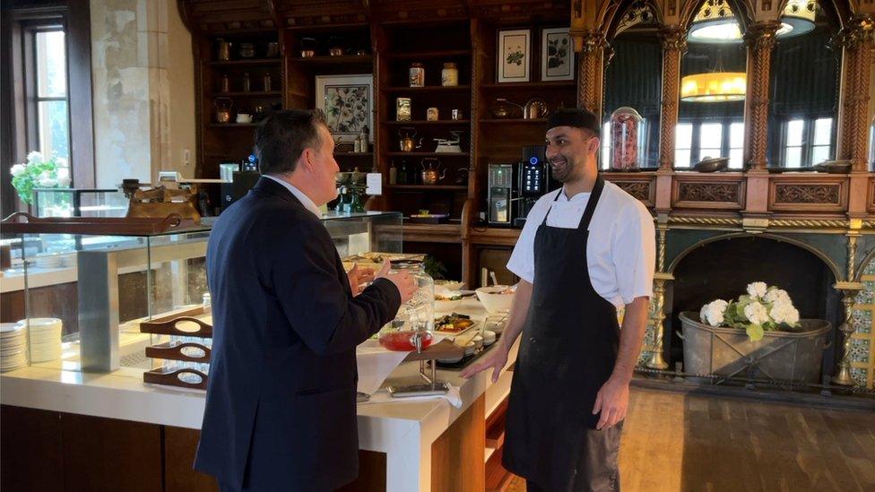 Raphael Herzog talks to his chef at a hotel near Bristol