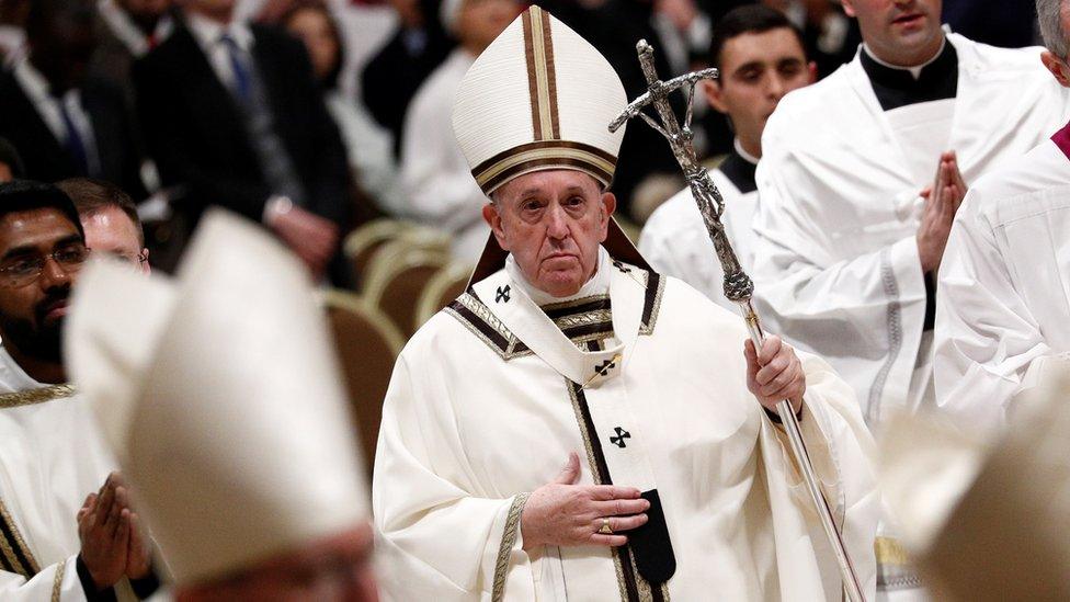 Pope Francis leaves after the Christmas Eve mass in St. Peter"s Basilica at the Vatican, December 24, 2019